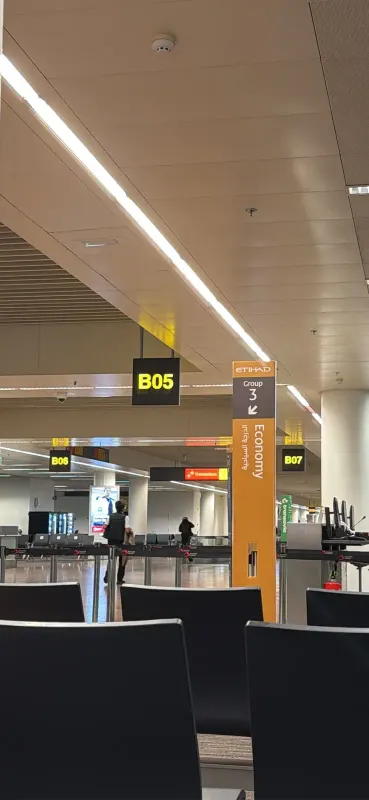 Gate B05 at Brussels Airport with the Etihad economy boarding sign for group 3