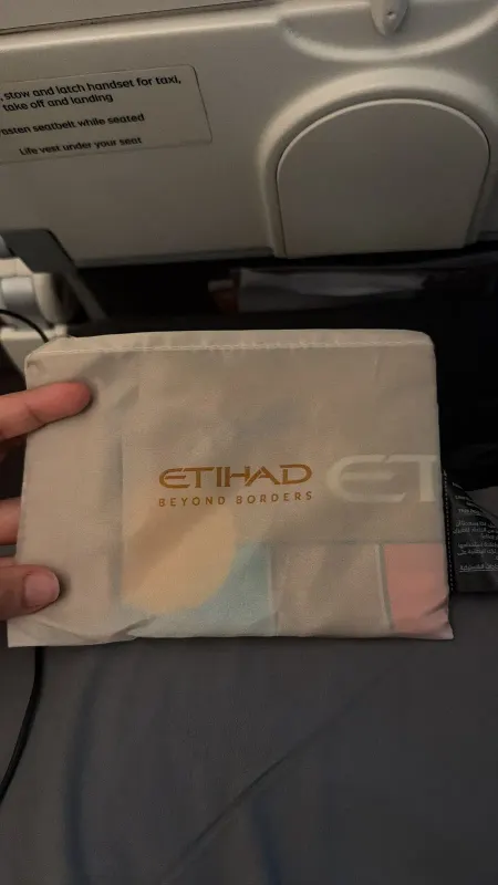 Etihad economy amenity pouch on the seat